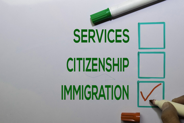 Services. Citizenship, Immigration with red checklist write on white board background.