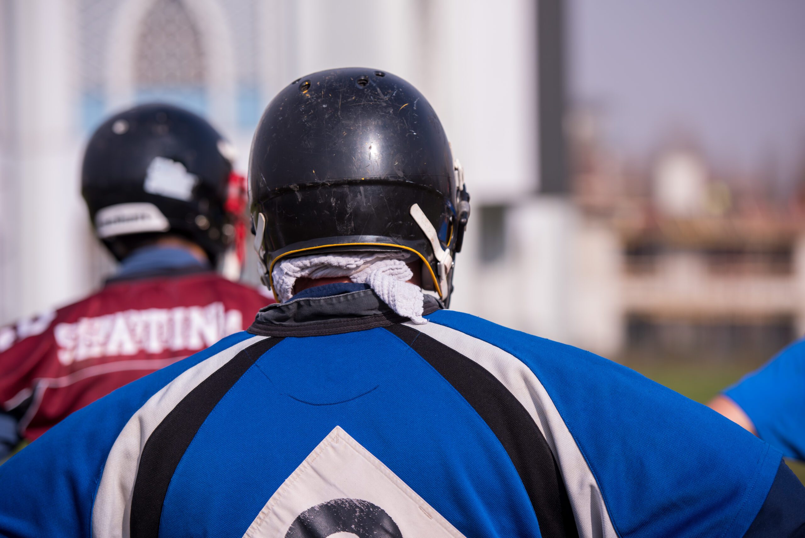 american football team with coach in action