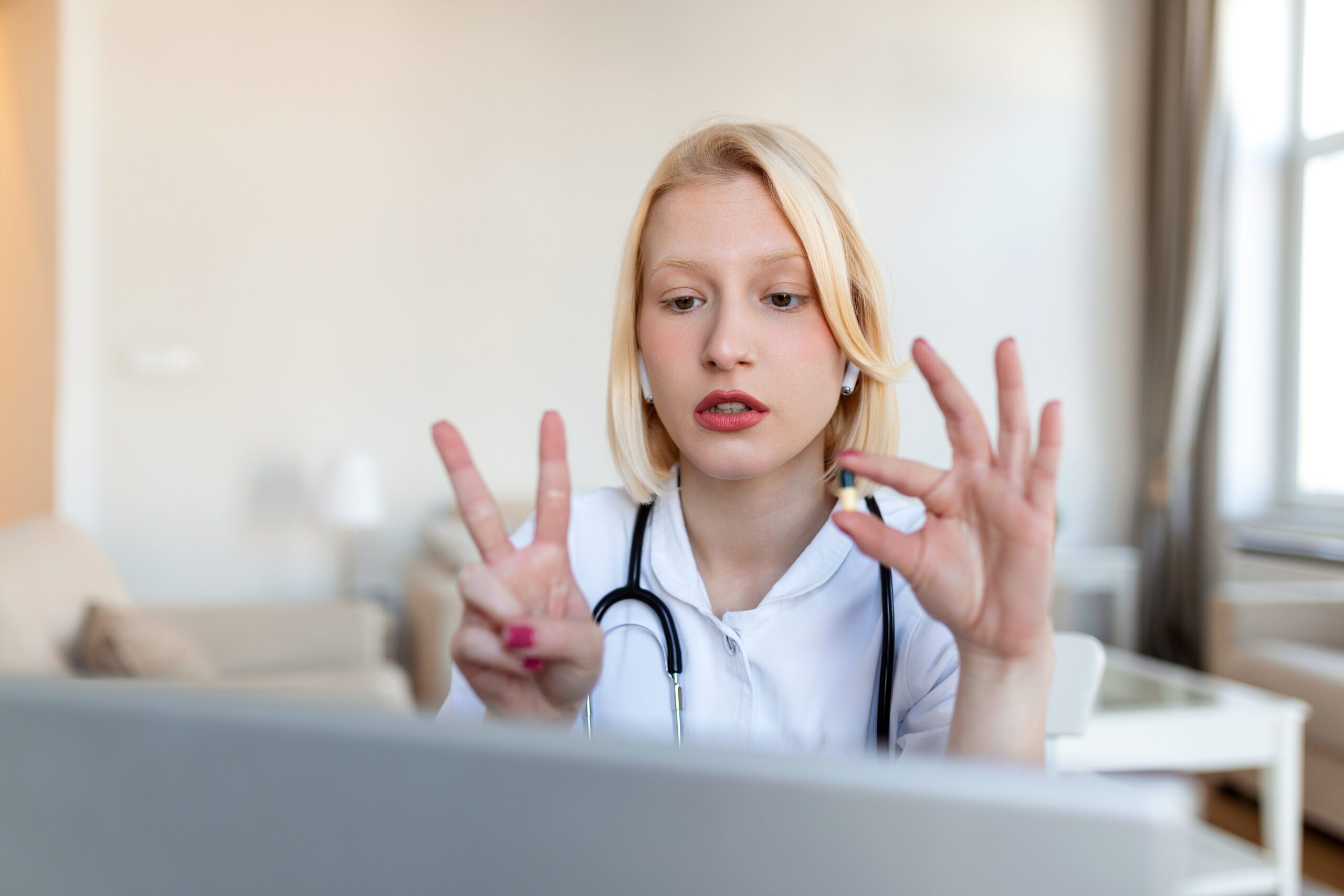 Female doctor having online therapy with her patient's, giving them advice while using telemedicine as a new normal during COVID 19 pandemic outbreak